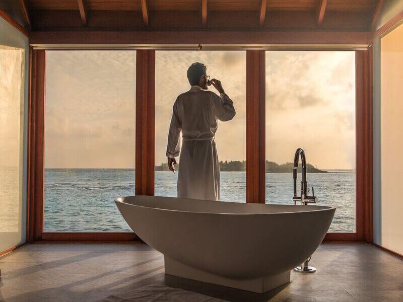 Man relaxing after taking an epsom salt bath