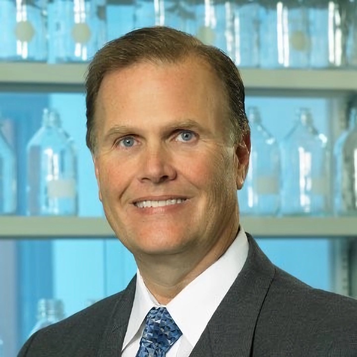 Steve Jenkins in a black suit, smiling and looking towards to the camera